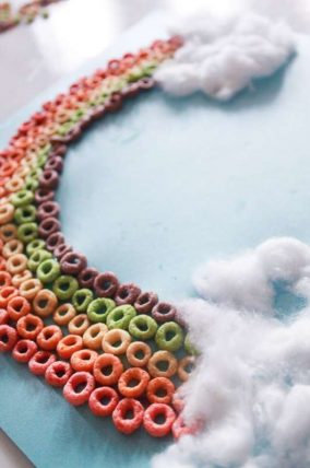 Make a colorful Cheerio rainbow craft with the kids