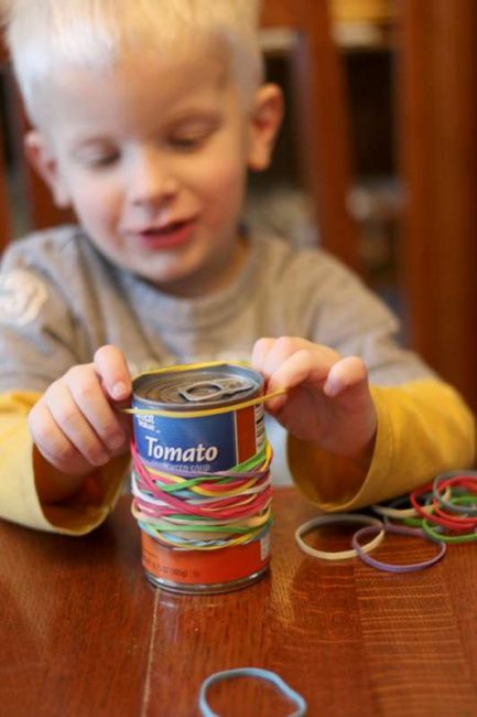 This activity is a great way to keep kids busy - just rubber bands and a soup can from the pantry!