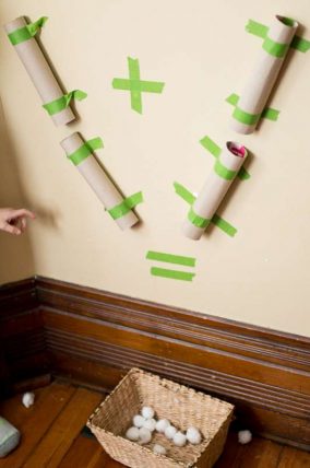 A visual addition activity using a pom pom drop