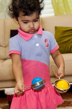 This scoop and transfer activity looks would keep a toddler busy for hours!