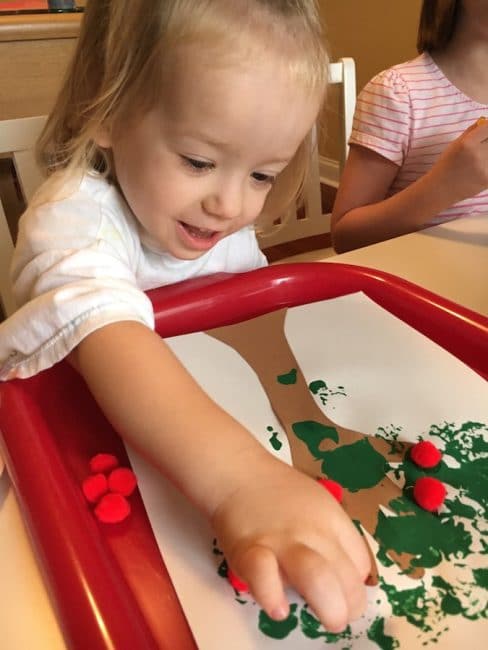 This Handprint Apple Tree craft is a super simple way to welcome fall!