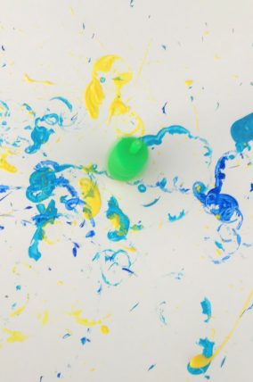 Dreidel paint spinning is a classic activity every kid should do doing Hanukkah!