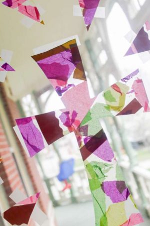 A beautiful and simple cross Easter craft for kids (especially toddlers) to make for a Christian art project with contact paper that has a stained glass cross effect! So pretty!