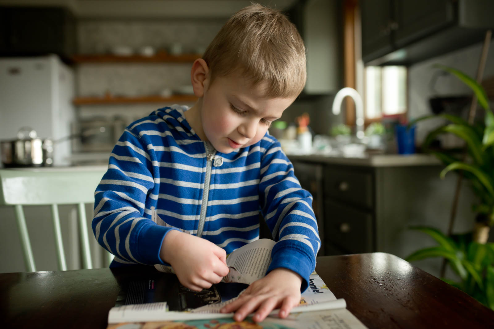 Tearing paper is a great activity to work on their fine motor grasp and control.