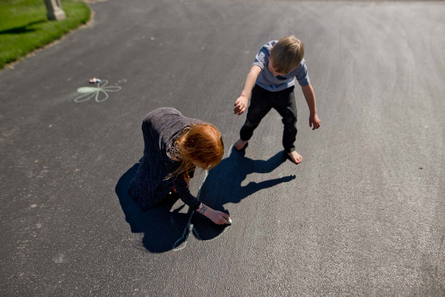 Tracing interesting shadow poses to create chalk art for kids