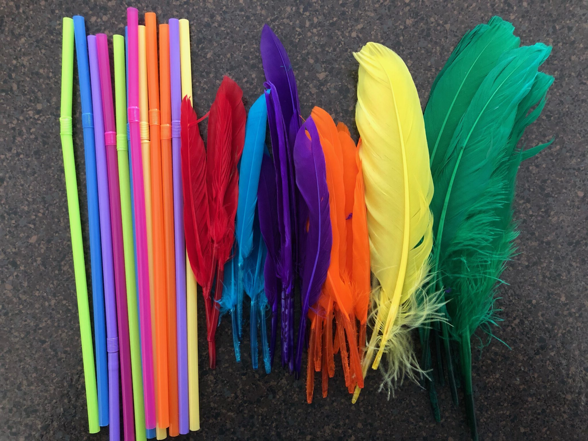 Simple feather and straws color matching threading activity for toddlers and preschoolers at home.