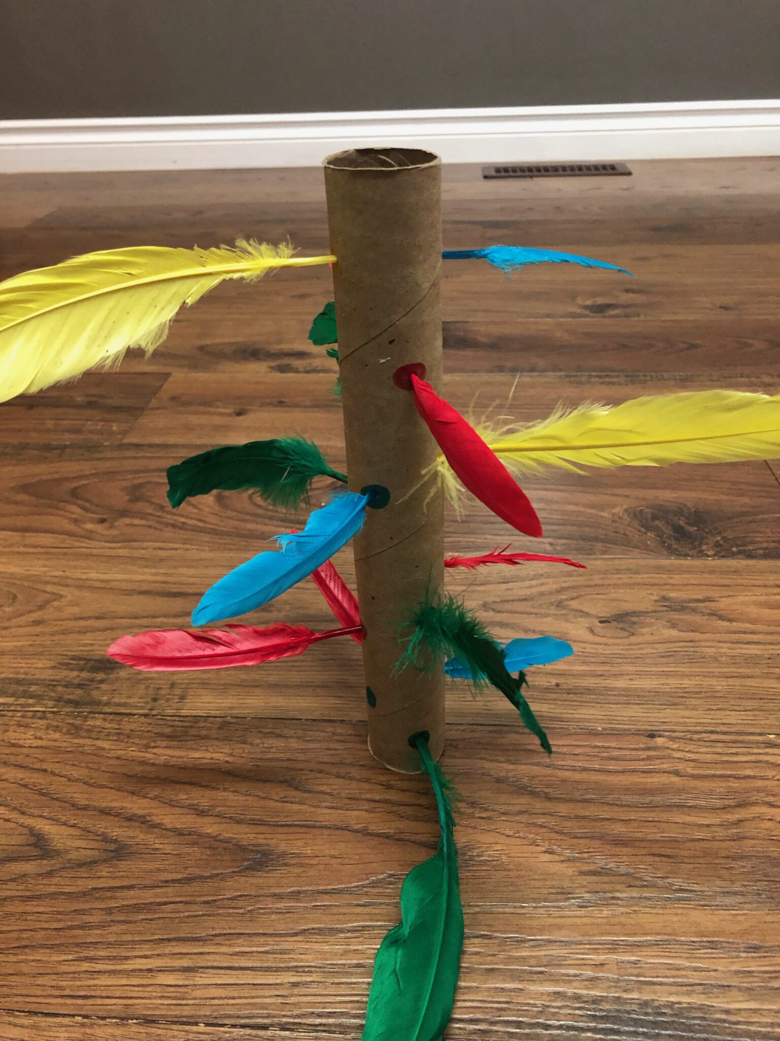 Feather poke fine motor color activity for toddlers and preschoolers.