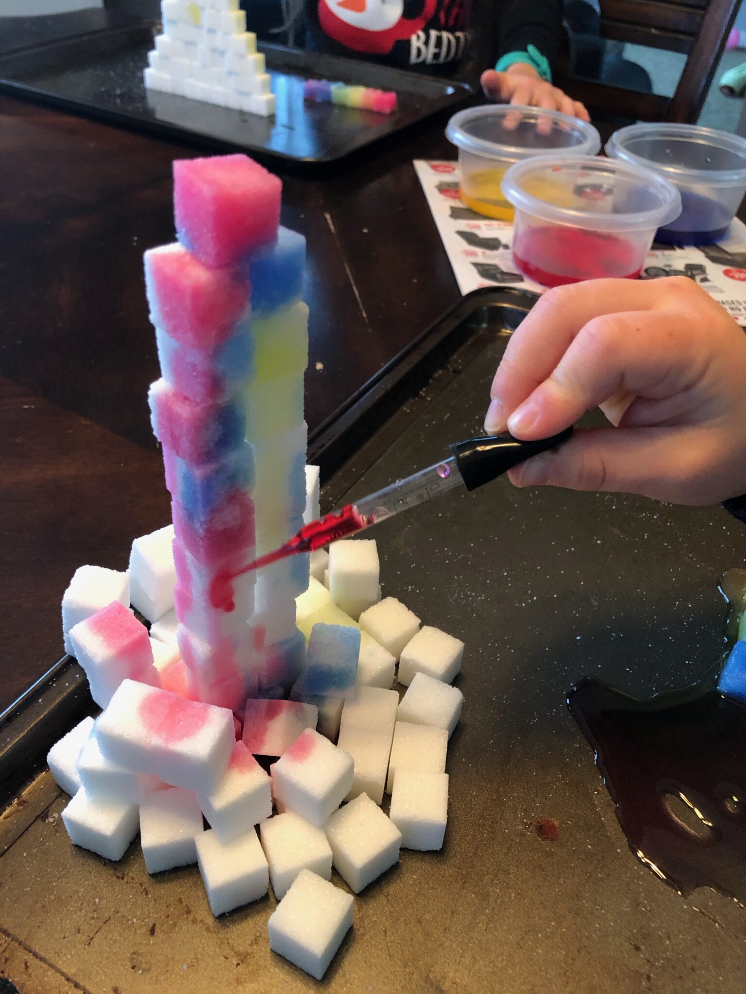 Grab a box of sugar cubes and get creative with these simple activities for kids. Fun from building towers to rainbow colored sugar cubes.