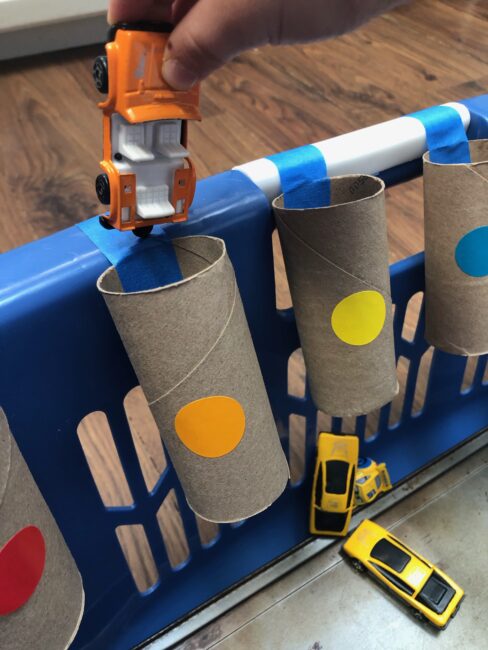 Give playing cars with your toddlers a new and exciting learning twist with these 2 easy activities that use recyclable cardboard tubes!