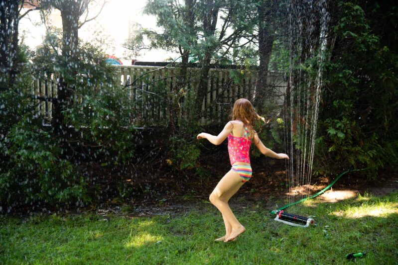 Beat the heat this summer with a simple fun DIY backyard water obstacle course using household supplies for your kids to cool down outside. 