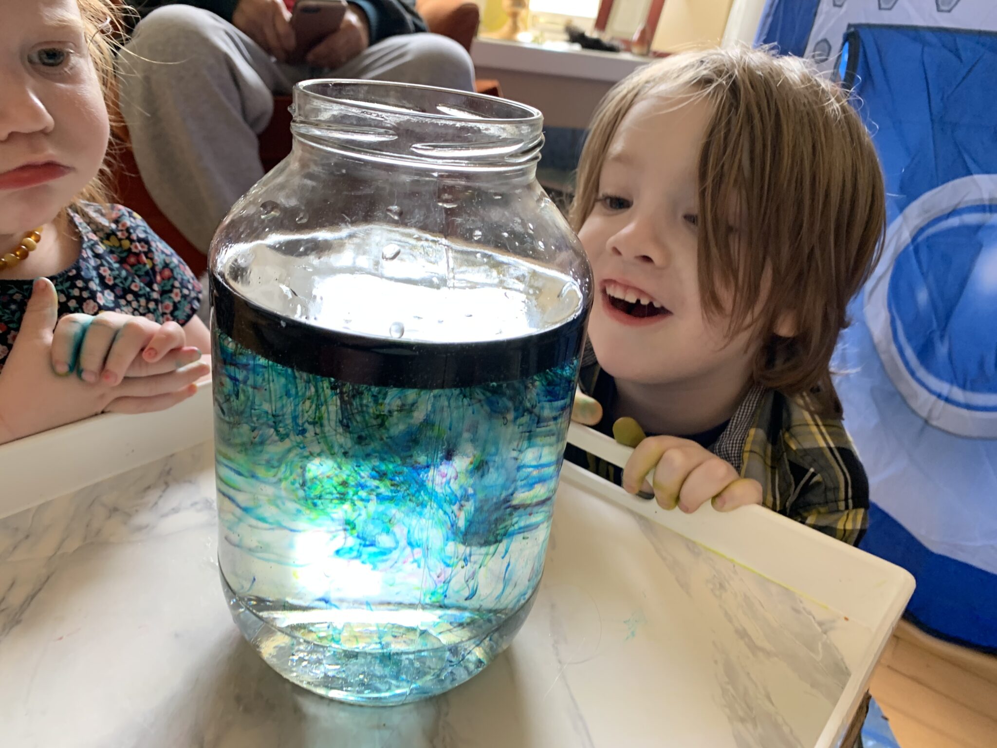 Make your own little shooting stars in a jar galaxy space experiment at home using simple supplies for kids.