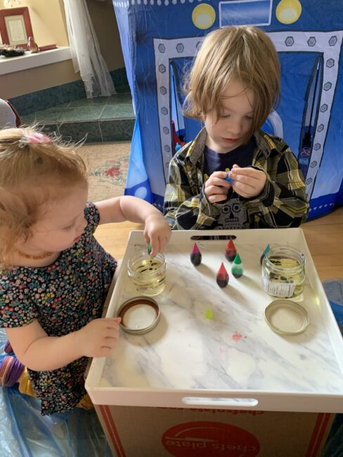 Great fine motor practice part of your space experiment squeezing food coloring into oil jars.