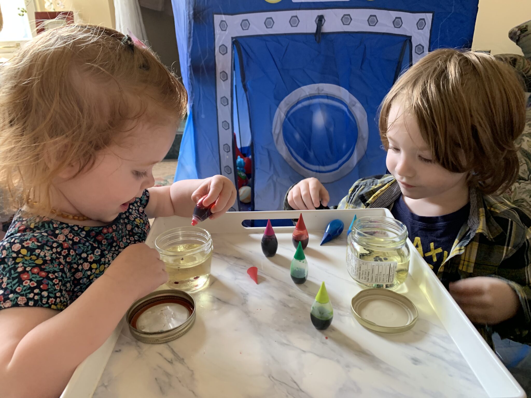 Add food coloring drops into oil like little floating planets.