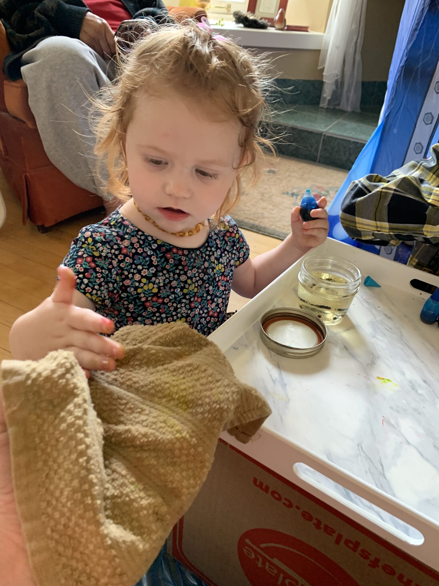 Have a cloth ready to clean up spills and wipe hands.