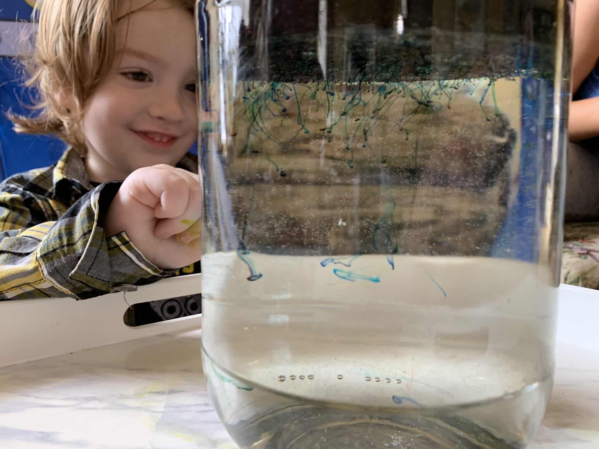 Make your own little shooting stars in a jar galaxy space experiment at home using simple supplies for kids.