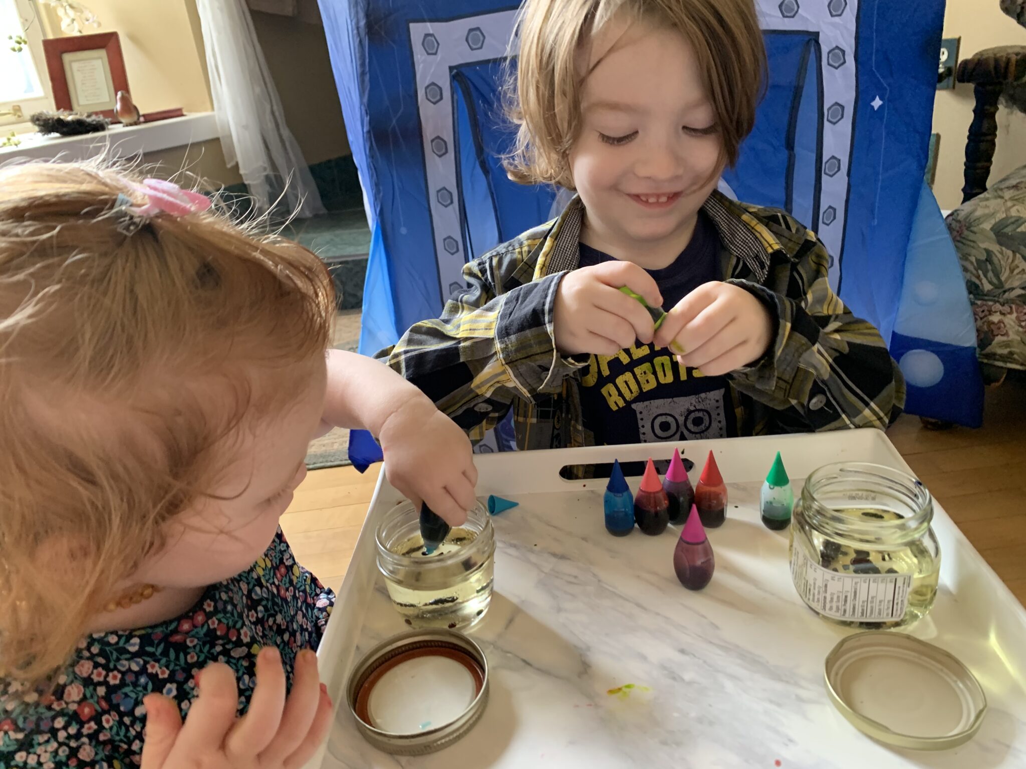 Keep adding food coloring to oil jars until you have a good bottom layer.