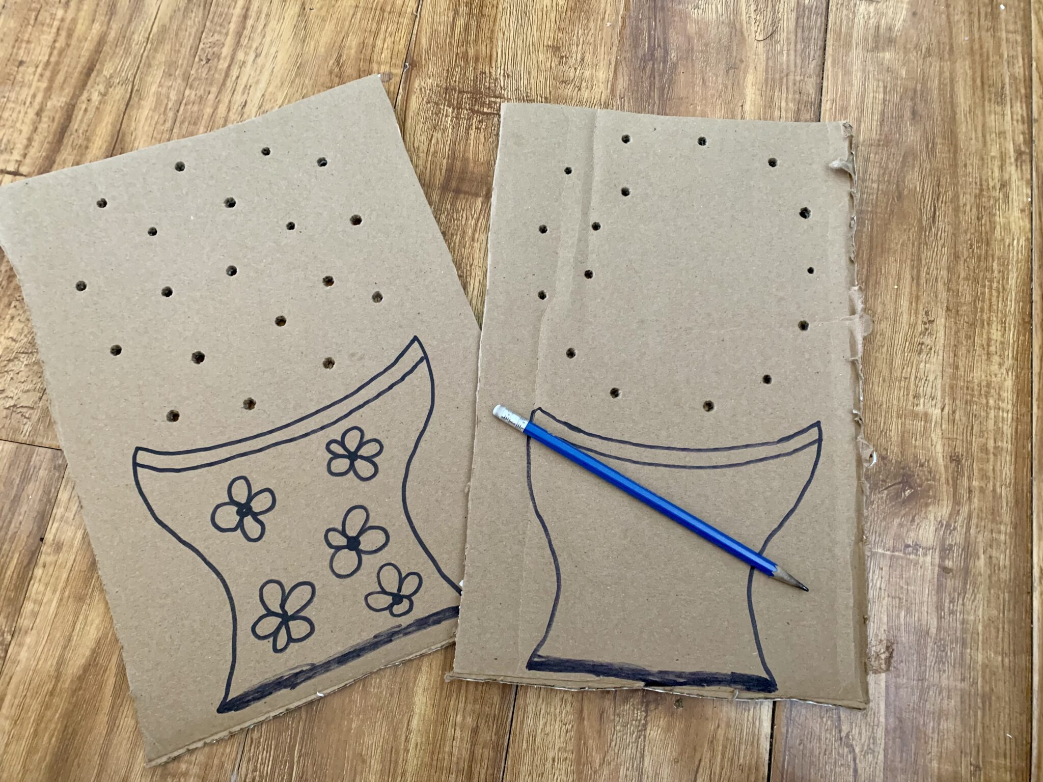 Poke holes in the cardboard for threading flowers through in your outdoor activity.